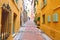 Narrow street of Menton old town, France