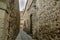 Narrow street of the Middle Ages in the historical center of Caceres