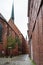 Narrow street near Bremen Cathedral in rain