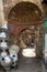 Narrow street with old building and traditional Egyptian aluminum vases, Old Cairo, Egypt