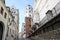 Narrow street between old houses and the Ducal Castle in Szczecin, Poland, former seat of the dukes of Pomerania-Stettin, blue sky