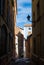 A narrow street with old houses and lanterns on the wall at medieval town Teruel