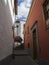 Narrow street in old village garachico with traditional red and