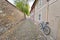 Narrow street with paving stones and old buildings in Prague, Czech Republic. Prague city center.