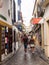 Narrow street with tourist stores - Cordoba, Spain