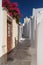 Narrow street in traditional Cyclades style Emporio village