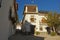 Narrow street with white houses in Albayzin neighbourhood, Granada