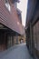 A narrow street with wooden buildings in Bryggen, Bergen, Norway.