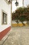 Narrow streets and bougainvillea plant in the village of Obidos founded by the Celts in 300 BC, Portugal