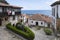 Narrow streets of the historic district of Lastres, Asturias, Spain, with its typical steep cobbled streets and the port and sea