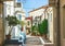 Narrow streets of Neorio town in Poros island, Greece; Old whit