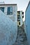 Narrow streets on a top of a city above Skopelos bay and harbor, Skopelos island