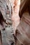 Narrow striped slot canyon walls.