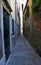 Narrow Venetian street called Calle in Italy