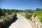 Narrow winding asphalt road between the rocks