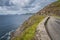 Narrow winding road on edge of cliff, Wild Atlantic Way of Dingle peninsula