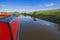 Narrowboat on a British canal in rural setting