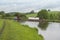 Narrowboat on a British canal in rural setting