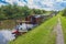 Narrowboat on a British canal in rural setting