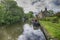 Narrowboat on a British canal in rural setting