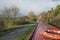 Narrowboat on a British canal in rural setting