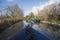 Narrowboat on a British canal in rural setting