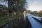 Narrowboat on a British canal in rural setting