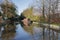 Narrowboat on a British canal in rural setting