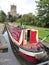 Narrowboat on canal by church