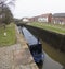 Narrowboat in a lock on a British canal in rural setting