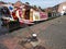 Narrowboat moored alongside wharf