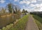 Narrowboat moored on a British canal in rural setting