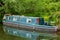 Narrowboat moored at canal in England UK