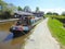 Narrowboat moored at side of canal