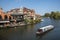 Narrowboat on River Thames seen from Windsor Eton bridge, UK