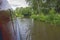 Narrowboat traveling on a British canal in rural setting