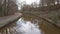 Narrowboat traveling on a British canal in rural setting