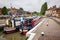 Narrowboats canal barges in a lock at Stoke Bruerne, UK