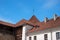 Narva, Estonia - Herman Castle. Tile roofs of buildings around the castle. Close-up.