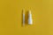 nasal drops  thermometer  various medicines lie on the table  top view  on a yellow background