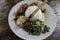 Nasi Campur Ayam Betutu. Balinese roast chicken stuffed with cassava leaves. Accompanied with steamed rice, Sate Lilit, Jukut