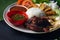 Nasi lemak kukus with quail meat top view, malaysian local food
