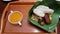 Nasi liwet on banana leaf with chicken egg tofu tempe and rice crisp