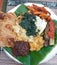 Nasi Padang - West Sumatra Indonesian meal of steamed rice with assorted dishes.
