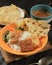 Nasi Pecel, Indonesian Traditional Menu with Spicy Peanut SAuce, Tempeh, Boiled Vegetable, and Fried Tofu, Rempeyek, Popular for