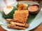 Nasi uduk with chicken satay , indonesian dish