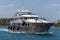 Nassau, Bahamas - May 14, 2019: Luxurious yacht Loon sailing in Nassau harbour. Some crew members on open decks. Turquoise water