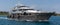 Nassau, Bahamas - May 14, 2019: Luxurious yacht Loon sailing in Nassau harbour. Some crew members on open decks. Turquoise water