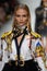 Natasha Poly walks the runway at the Versace show during Milan Fashion Week Spring/Summer 2018