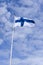 National Finnish Flag with blue cloudy sky